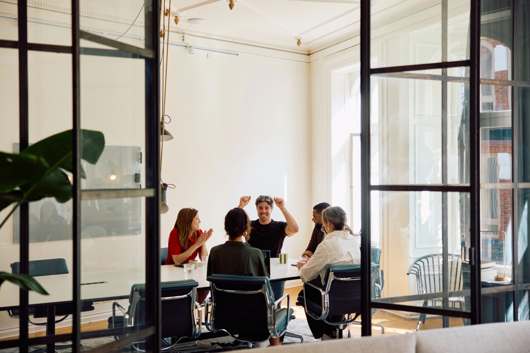 Business professionals brainstorming in a modern boardroom